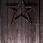 Star on wooden door by Crazy Ivory